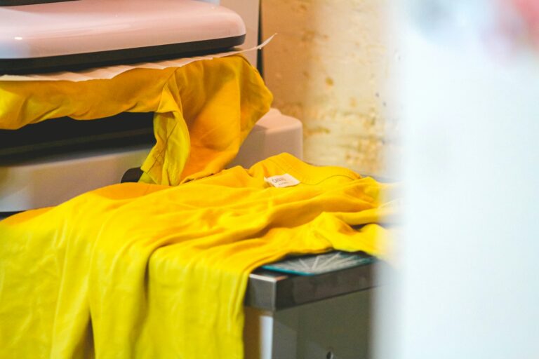 Custom T-shirt being made on a heat press in a small apparel workshop